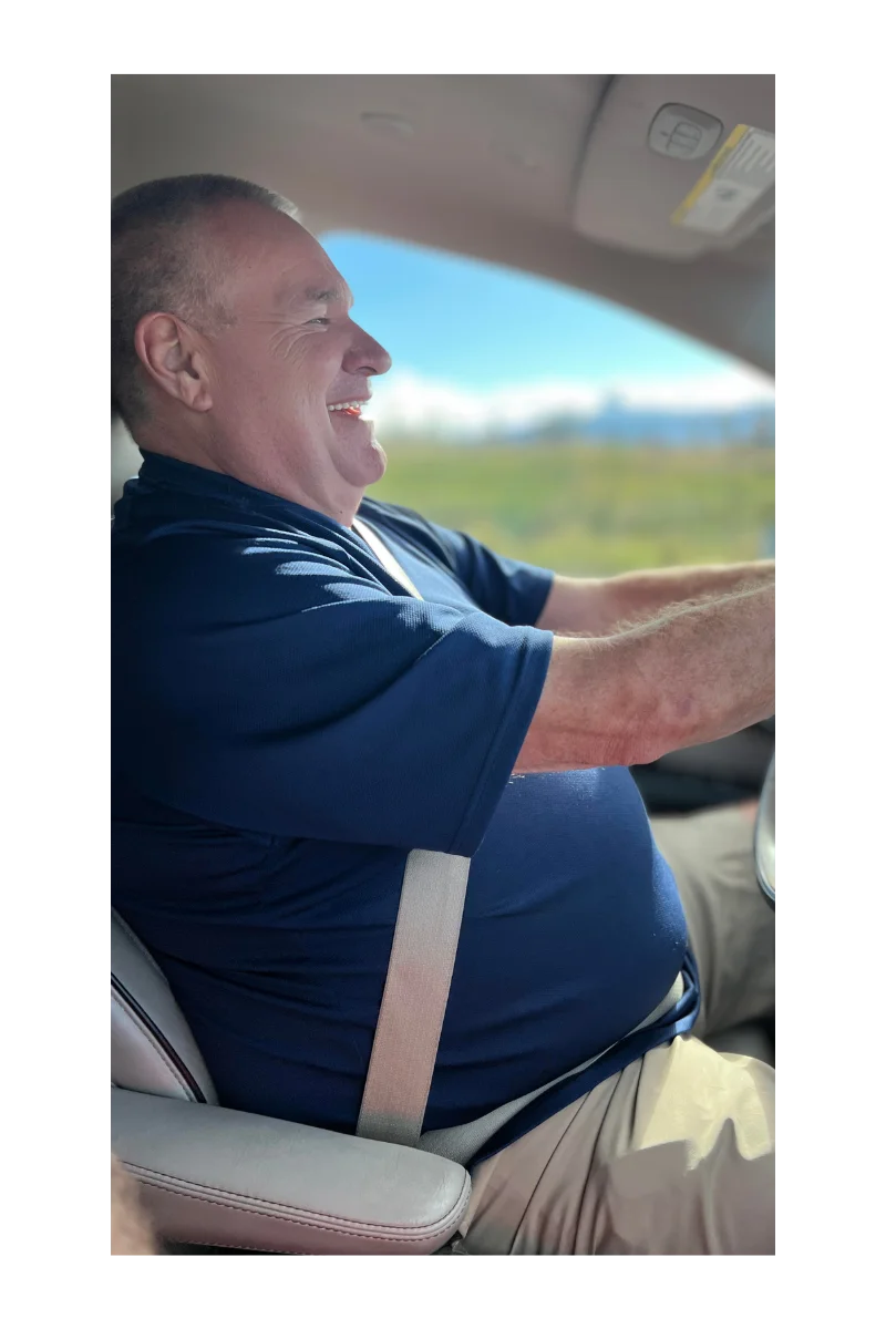 Joe driving in Hawaii in 2023, smiling and independent before sudden mobility loss – Journey Overland Expedition